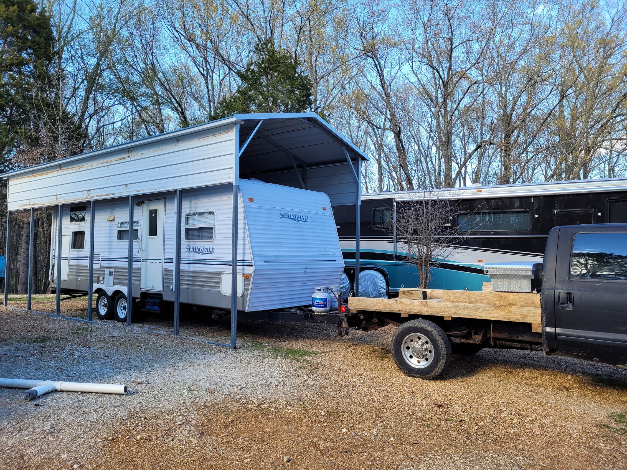 RV parked beneath completed covered carport