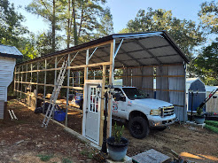Carport structure being enclosed with siding