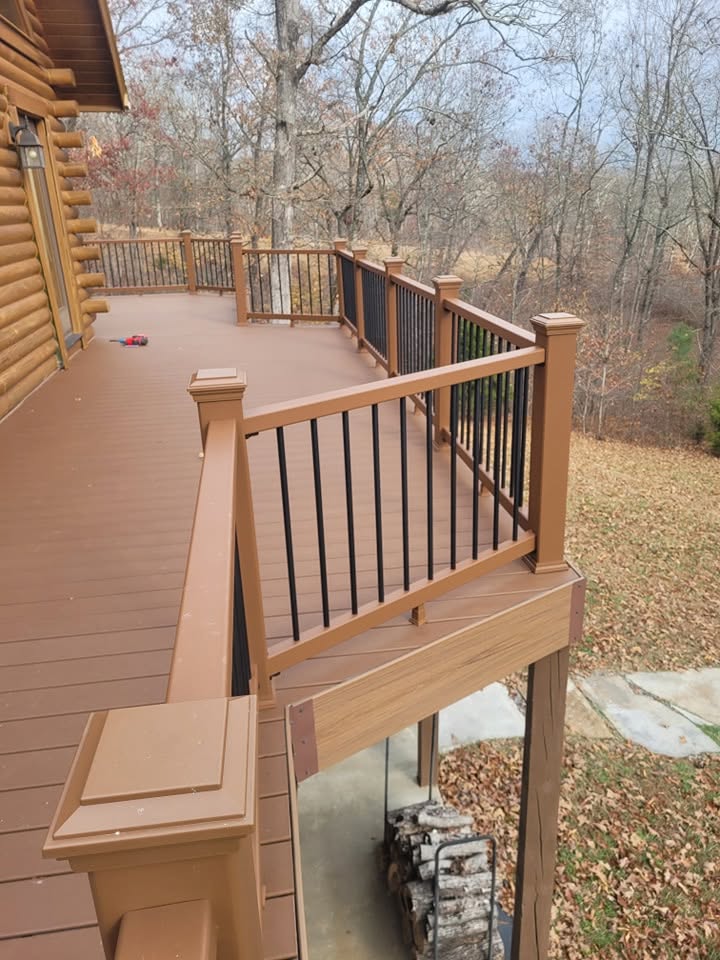 Custom railing and decking detail on log home deck